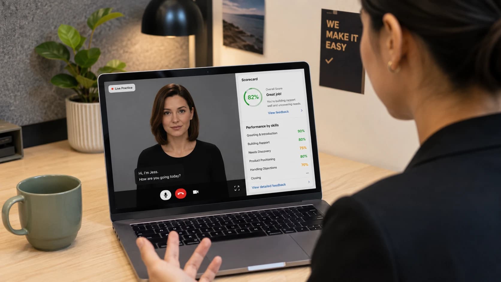 Sales associate practising a customer conversation with an AI avatar on a laptop, scorecard visible beside the avatar